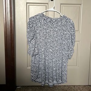 Navy Blue and white flowered shirt.